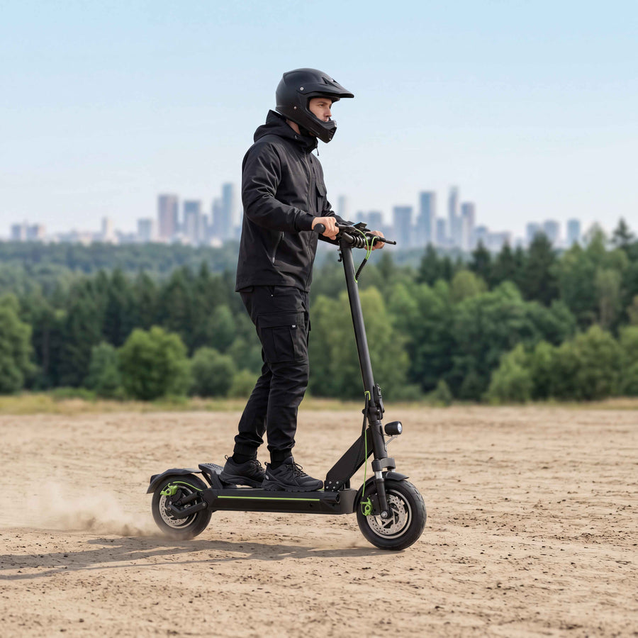 A_young_man_rides_a_black_off_road_electric_scooter_demonstrating_powerful_performance_and_all_terrain_capabilities