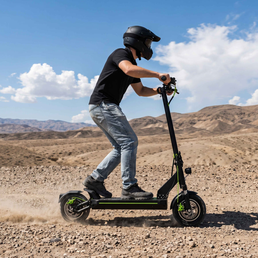 A_helmeted_young_man_is_shown_riding_an_off_road_electric_scooter_outdoors_demonstrating_its_powerful_performance_and_all_terrain_riding_capabilities